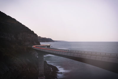 Bridge over sea against sky