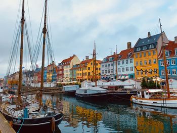 Boats moored at harbor