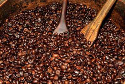 Abstract background and detail coffee beans original process by hand on dark