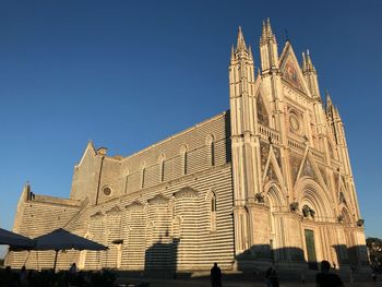 Low angle view of cathedral against clear blue sky