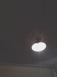 Low angle view of illuminated lamp