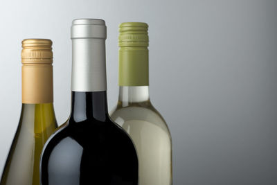 Close-up of bottles against white background