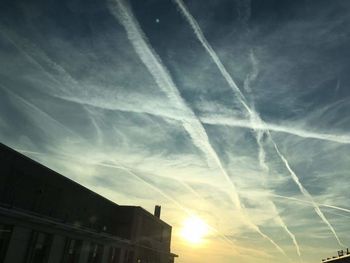 Low angle view of vapor trails in sky