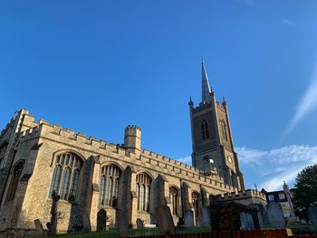 Low angle view of building against blue sky