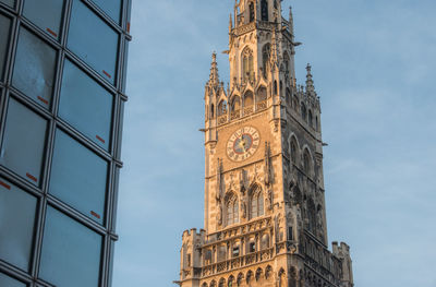 Low angle view of clock tower against sky