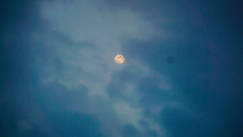 Low angle view of moon against sky at night