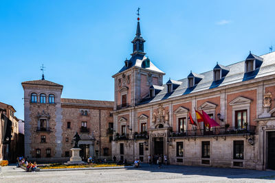 Buildings in city against sky