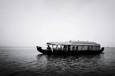 Ship in sea against clear sky