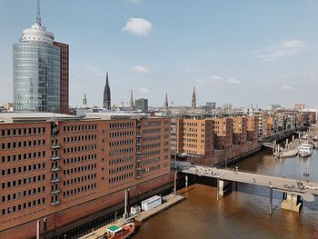 View of bridge and buildings against sky