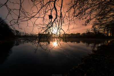 Scenic view of lake against sky during sunset