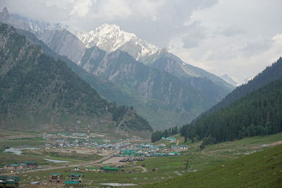 Village in valley amidst mountains