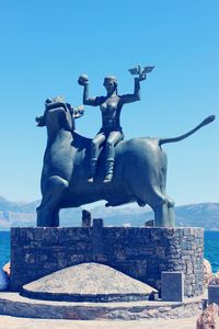 Statue of liberty against blue sky