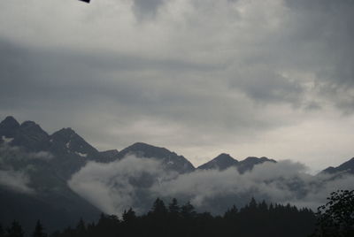 Scenic view of silhouette mountains against sky