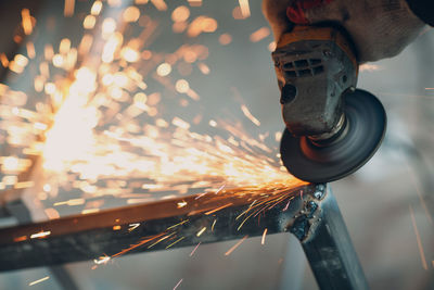 Close-up of person welding metal