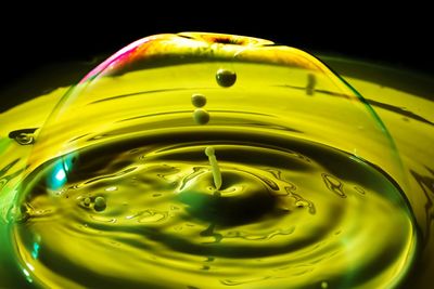 Close-up of yellow water in black background