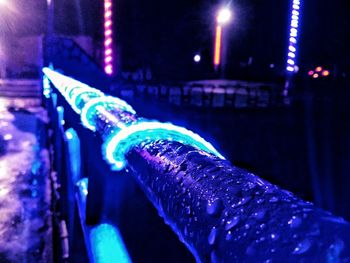 Close-up of illuminated lighting equipment at night