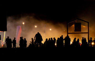 Silhouette people at music concert