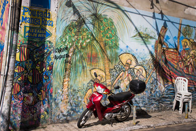 Full length of man with graffiti on built structure