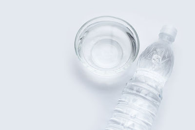 Close-up of glass bottle against white background