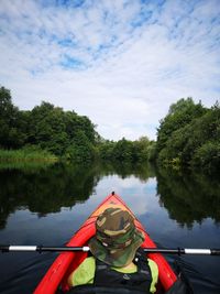 Reflection of trees in lake against sky