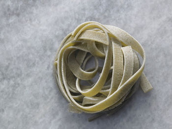 High angle view of tagliatelle pasta on table