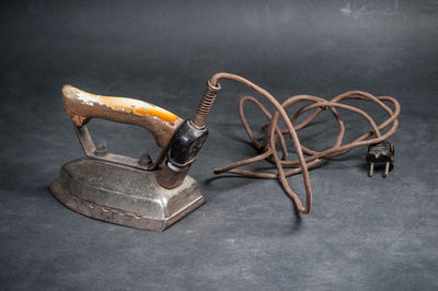 Close-up of machine part on table