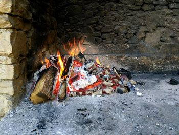 Logs burning at fireplace