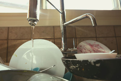 Close-up of faucet in bathroom