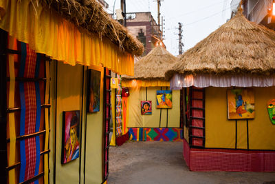 Multi colored houses by building