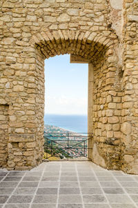 View of wall by sea against sky