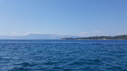 Scenic view of sea against clear blue sky