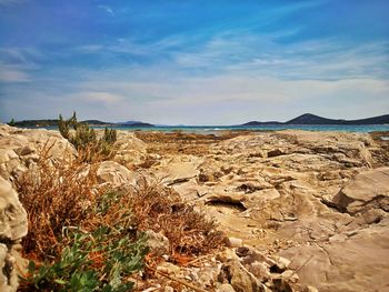 View of landscape against cloudy sky