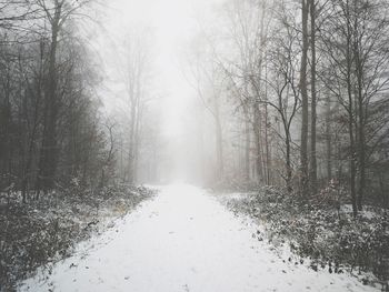 Scenic view of snow covered land during winter