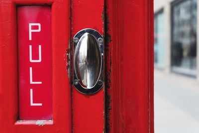 Pull - handle on a red london phone box