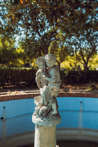 Close-up of statue against trees in park