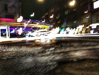 Illuminated city at night during winter