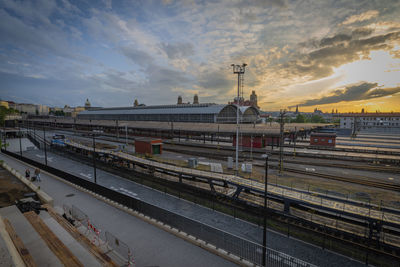 High angle view of railroad tracks against sky during sunset