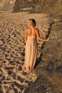 Rear view of woman on beach