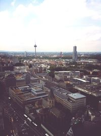 High angle view of city against cloudy sky