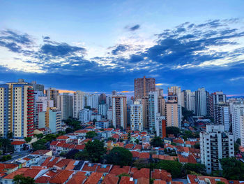 Modern buildings in city against sky