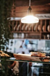 Illuminated pendant light in restaurant