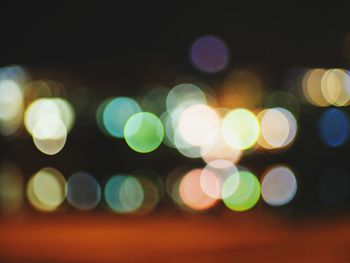 Defocused image of illuminated lights at night