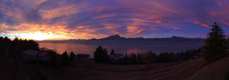 Panoramic view of silhouette landscape against sky during sunset