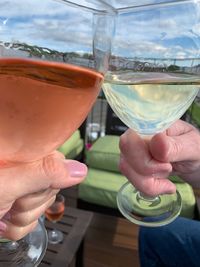 Close-up of hand holding glass of juice