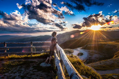 Scenic view of land against sky during sunset