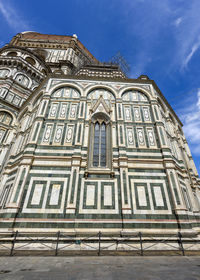 Low angle view of ornate building against sky