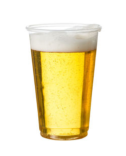 Close-up of beer glass against white background