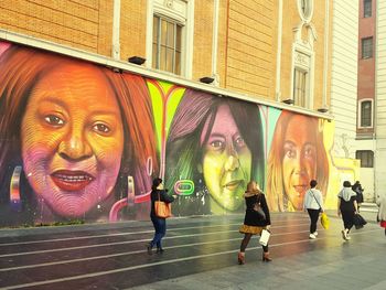 Portrait of people against building