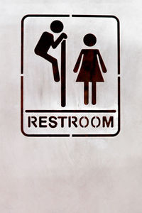 Close-up of information sign against white background