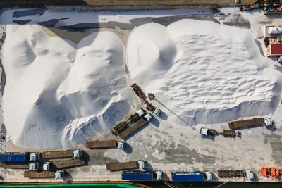 High angle view of people on snow covered mountain